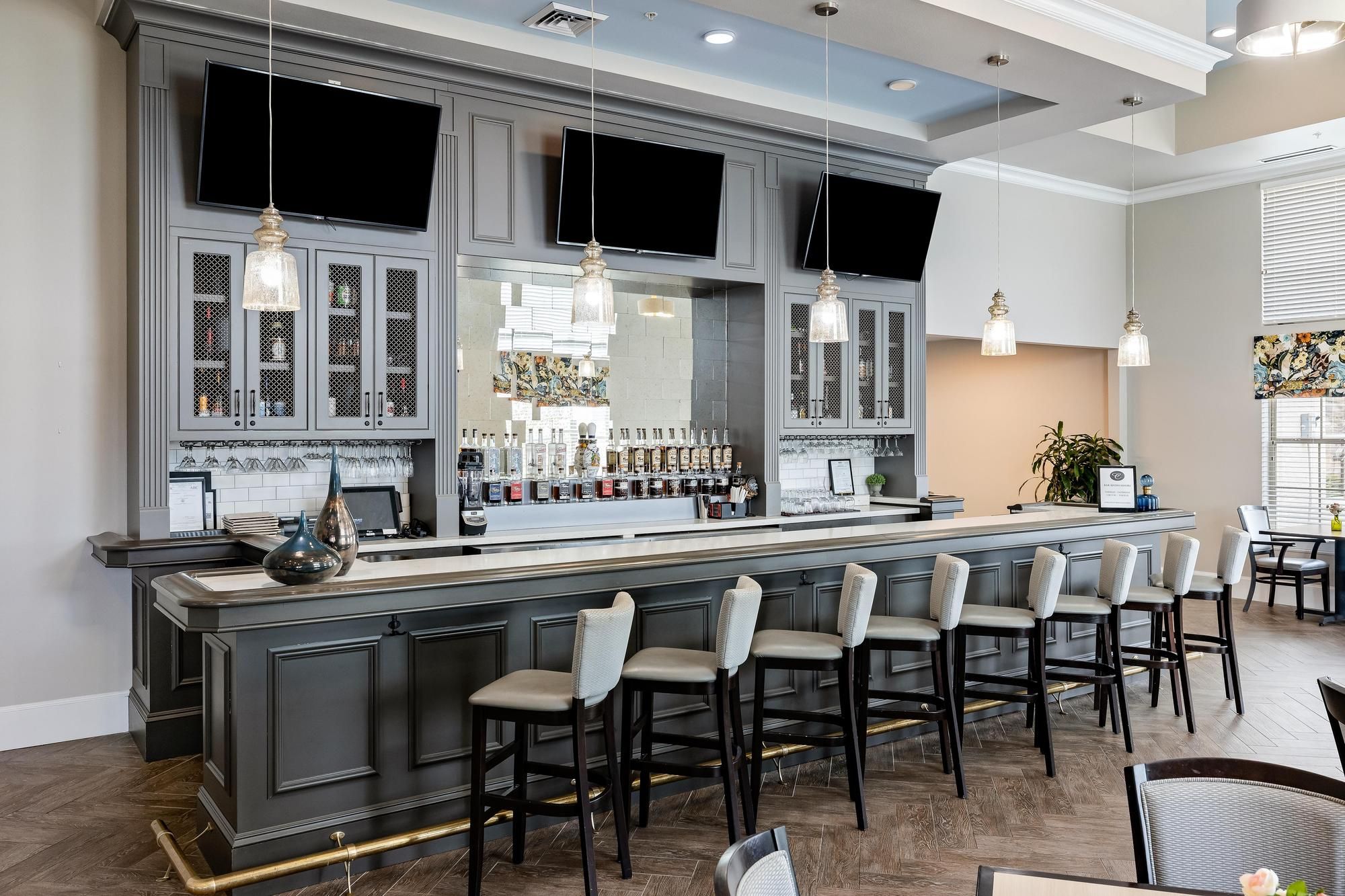 The Claiborne at Baton Rouge bistro and bar with elegant finishes and seating at senior living community