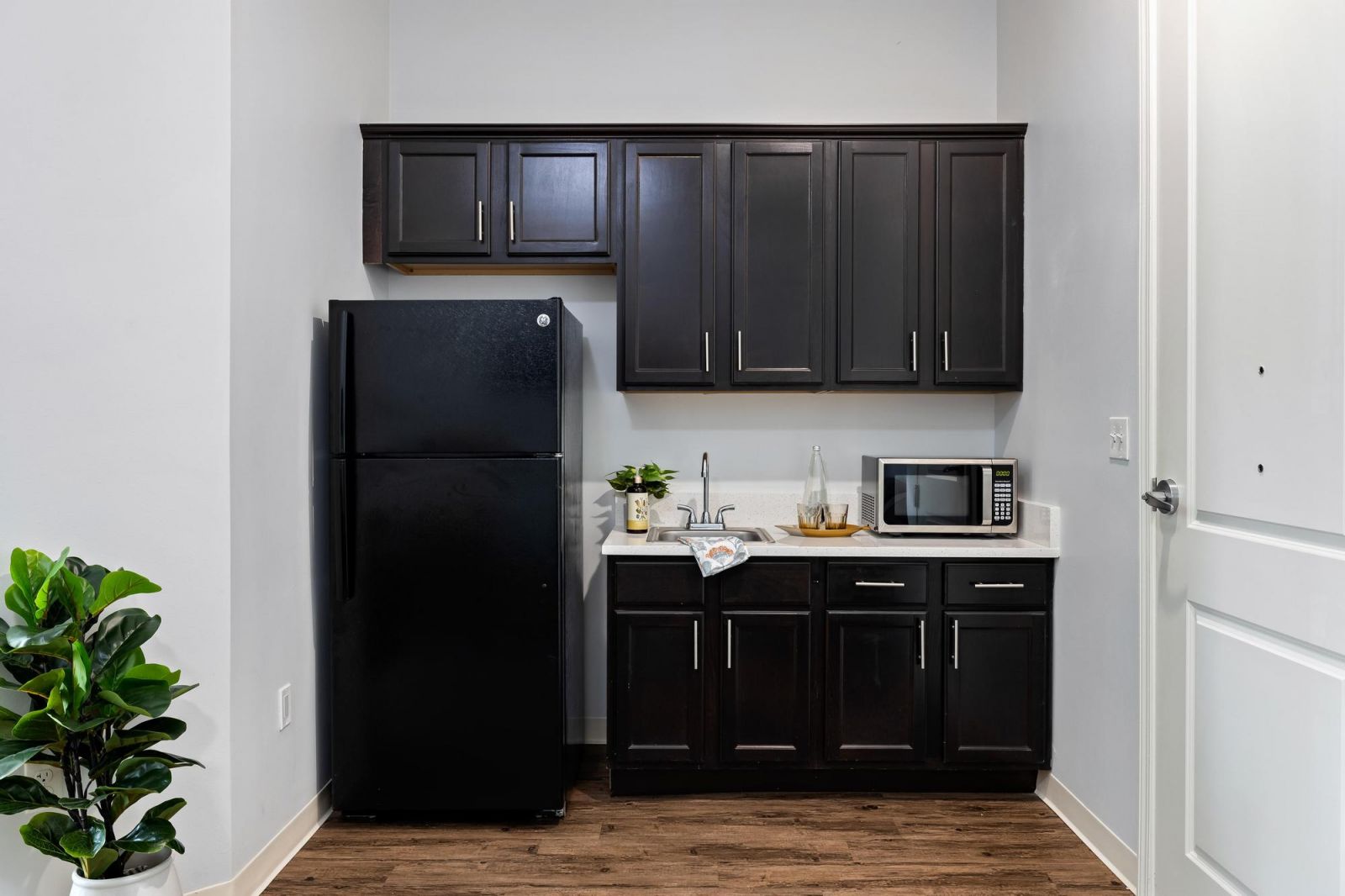 The Claiborne at Baton Rouge assisted living kitchenette showing accessibility features including sink and cabinet height