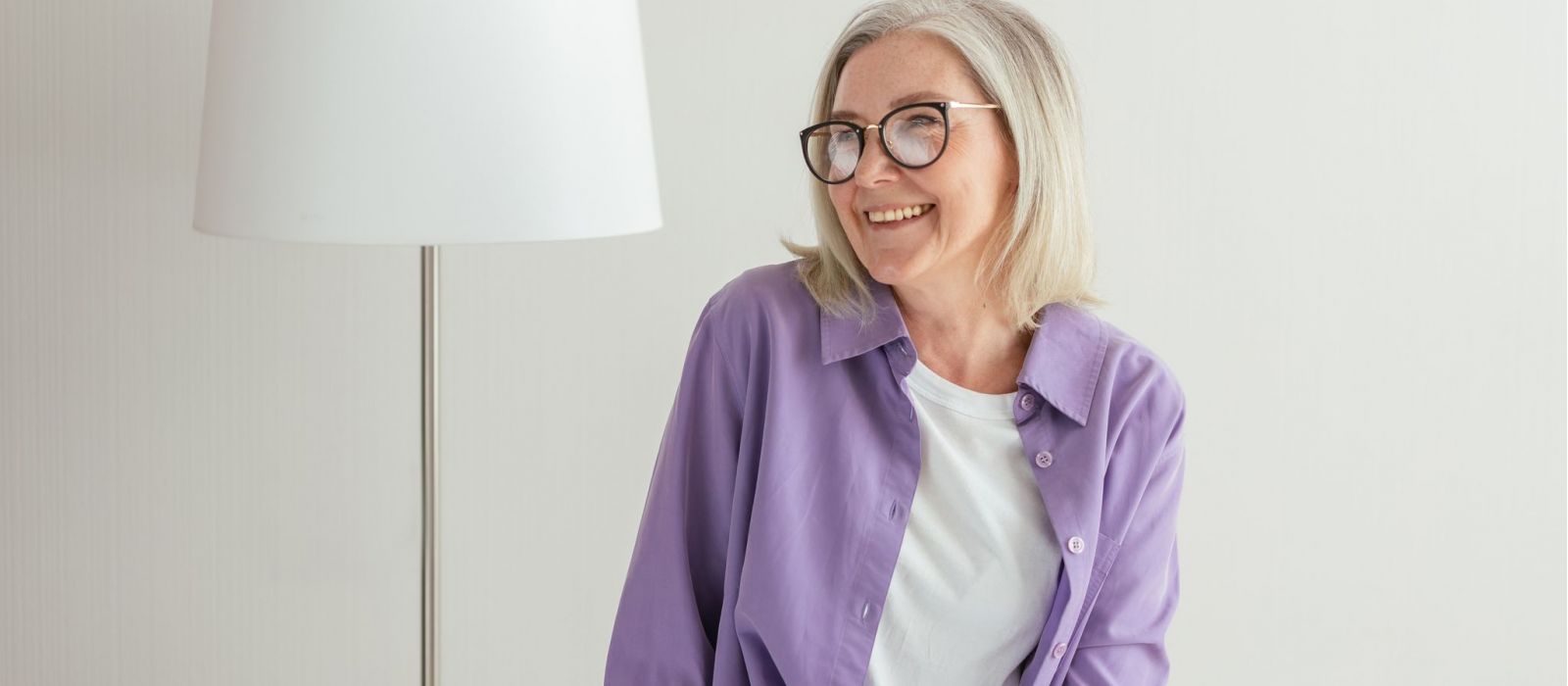 Smiling senior woman with glasses portrait.