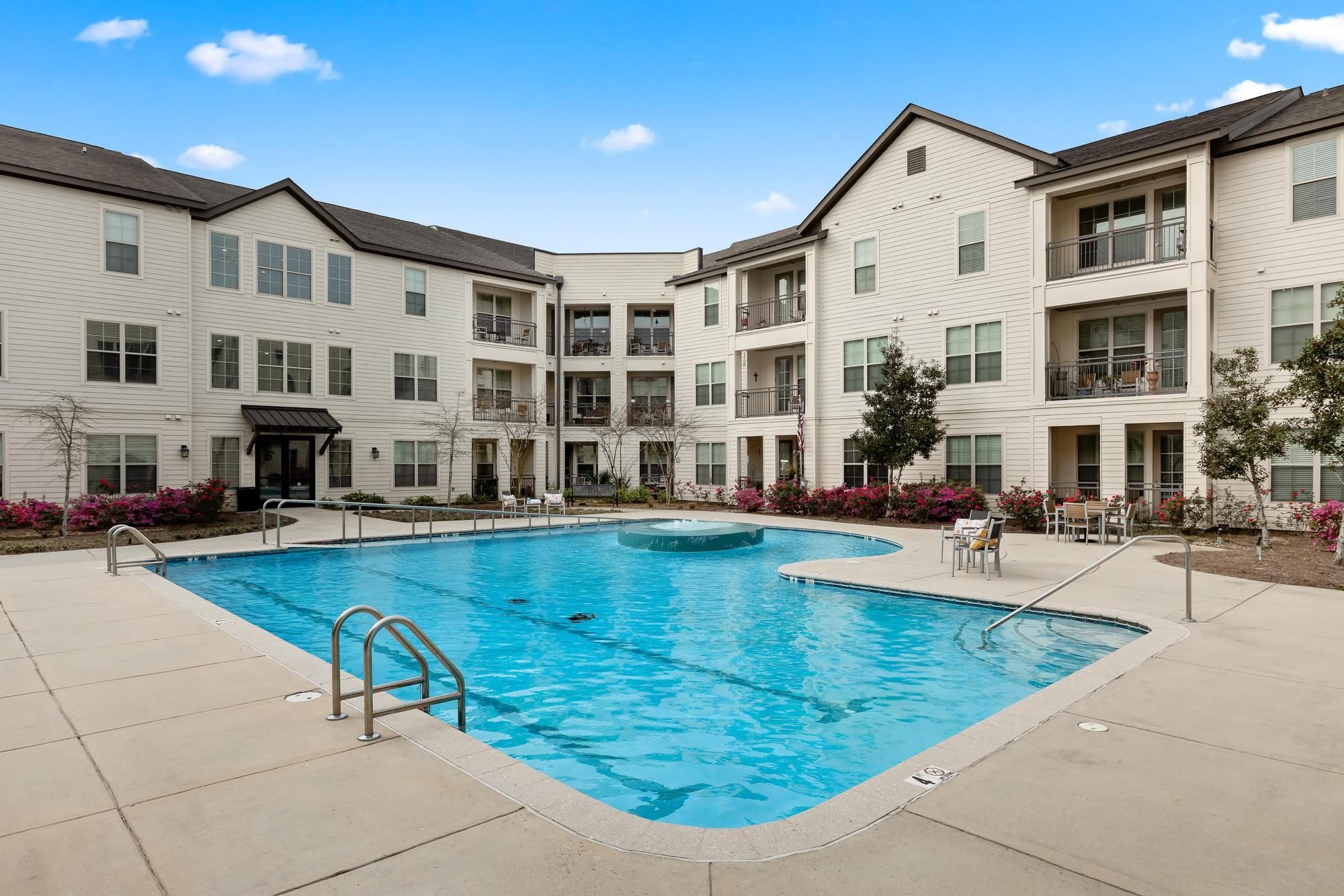 The Claiborne at Baton Rouge luxurious outdoor pool at senior apartment community