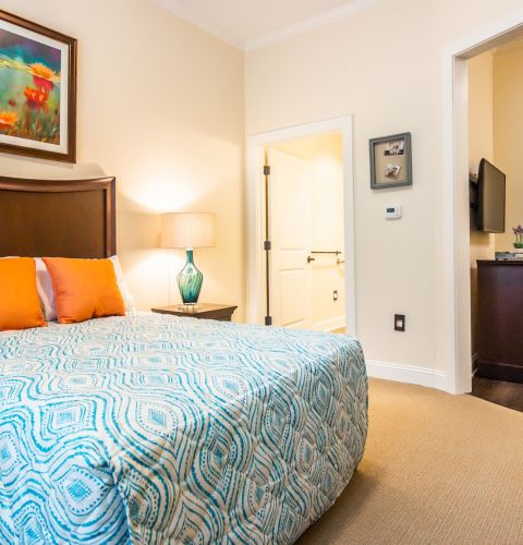 Brickmont at Acworth spacious apartment bedroom furnished with large bed and en suite bathroom