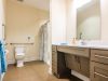 Brickmont at Acworth apartment bathroom with walk-in shower, accessible sink, and ample storage