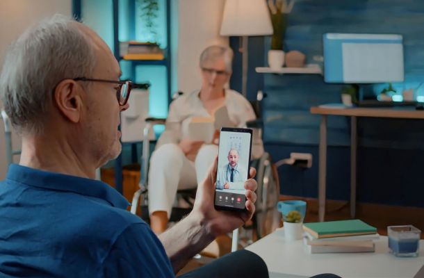 A senior man on a virtual telehealth visit with a doctor