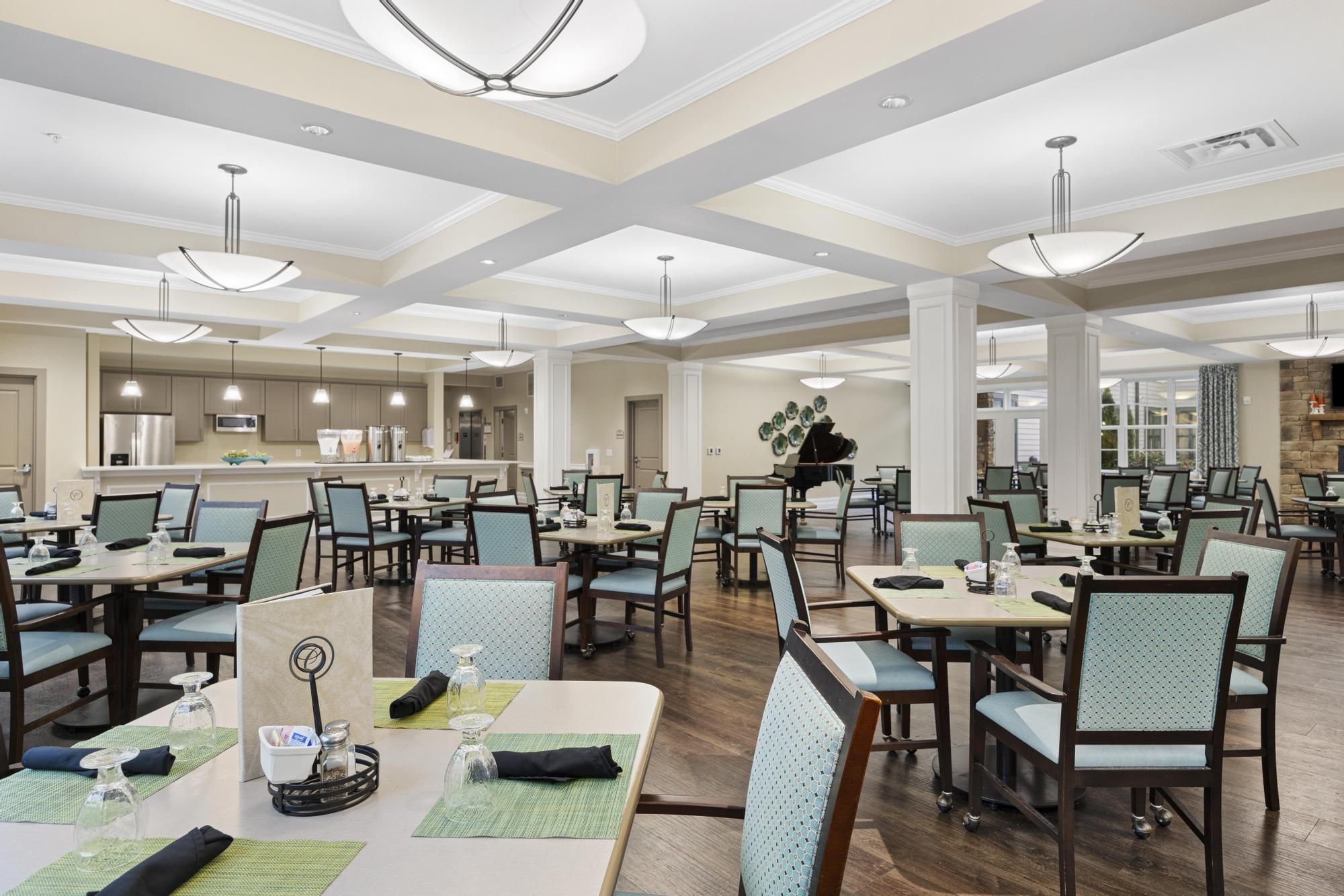 Brickmont at Johns Creek senior living community amenity private dining room with dining table and chairs and upscale furnishings