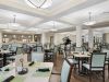 Brickmont at Johns Creek senior living community amenity private dining room with dining table and chairs and upscale furnishings