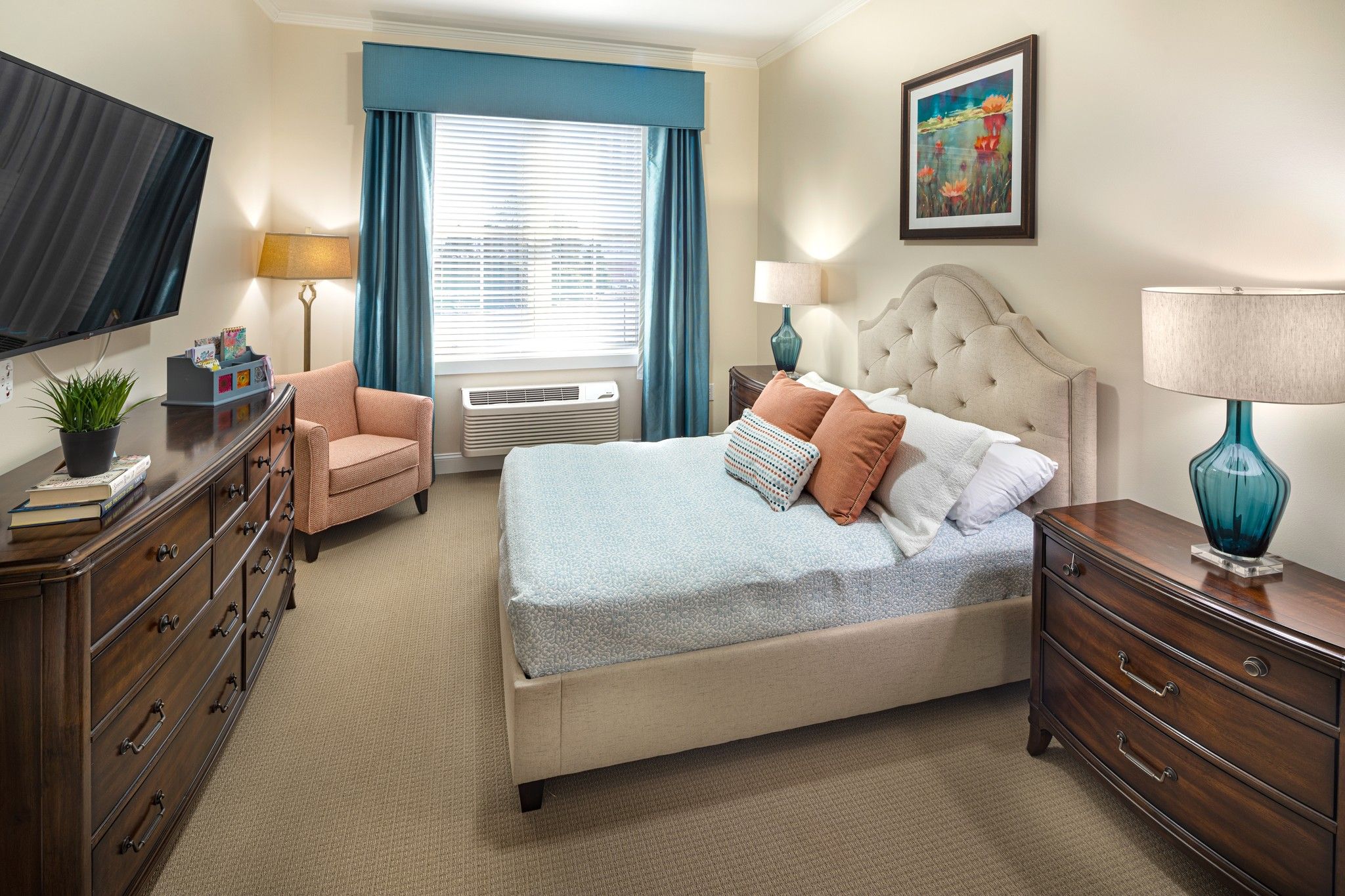 Brickmont at Roswell apartment bedroom with full sized bed, carpeting, and sliding barn doors to main living space