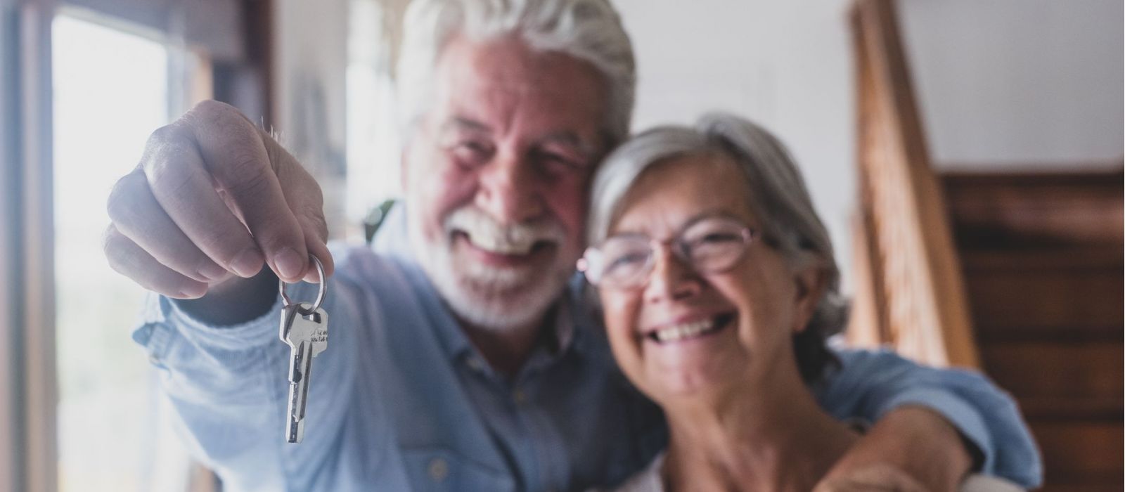 Senior couple with keys