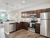 The Claiborne at Brickyard Crossing senior apartment full kitchen with high-end design and appliances