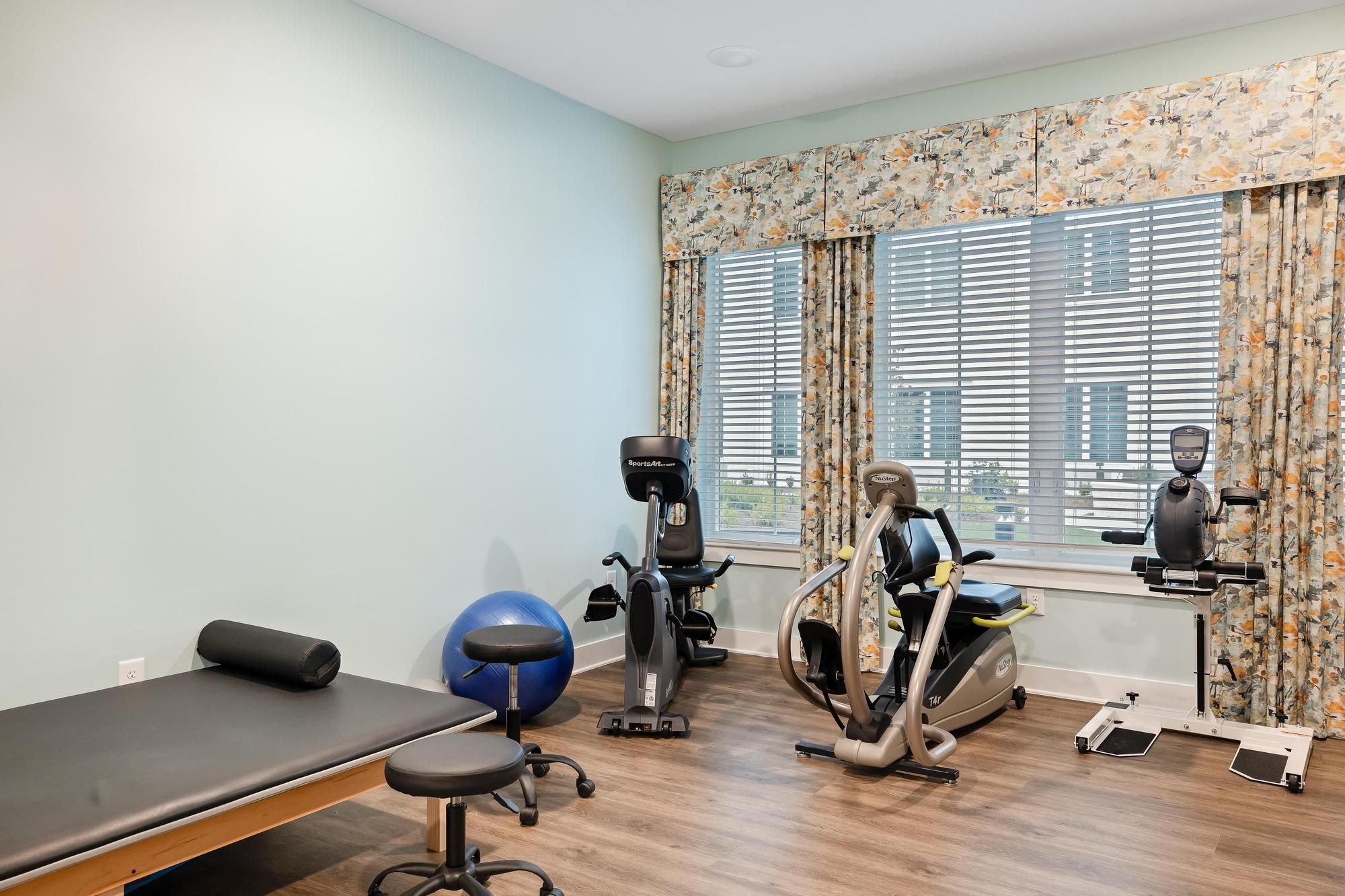 The Claiborne at Brickyard Crossing on-site therapy room and equipment