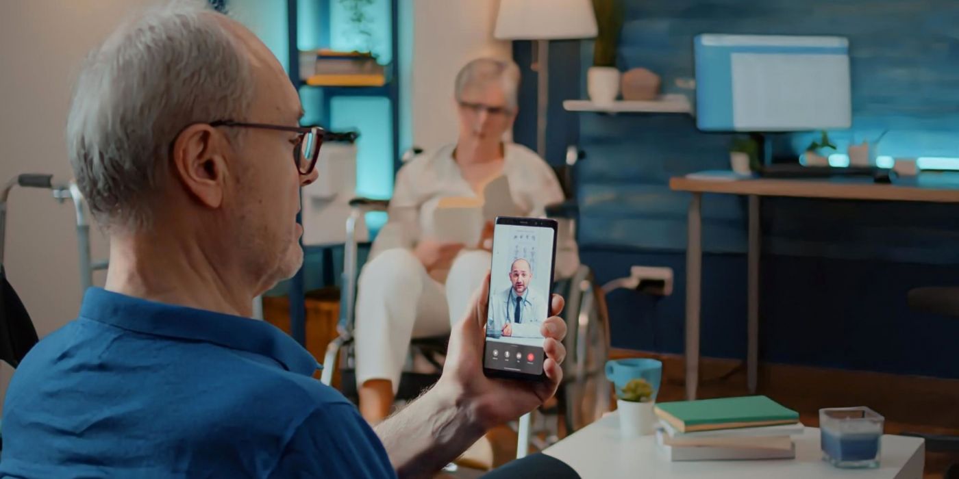 A senior man on a virtual telehealth visit with a doctor