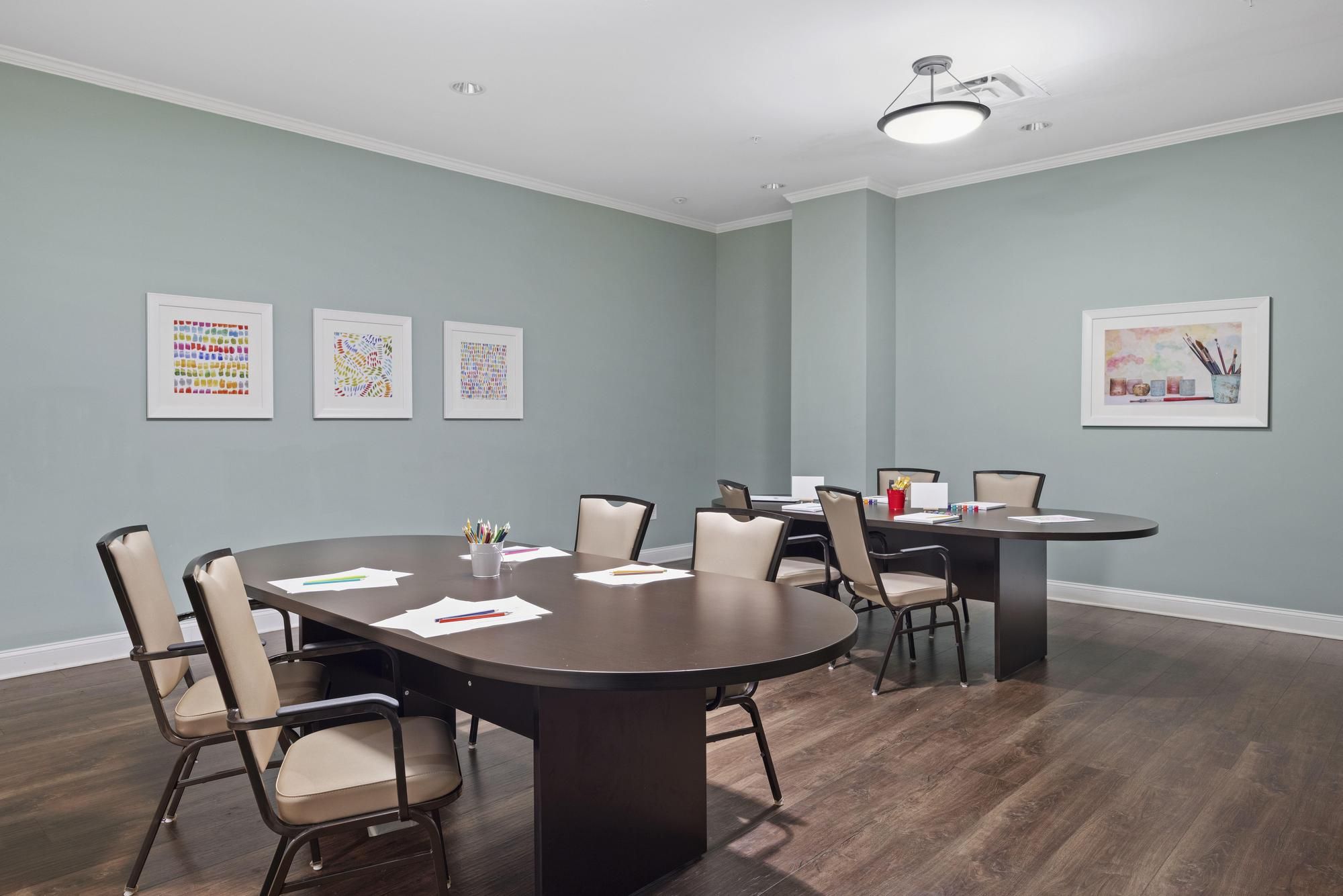 The Claiborne at Acworth senior living community art and painting activity in progress in the activity room