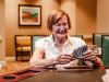The Claiborne at Acworth senior living community residents playing cards in the game room