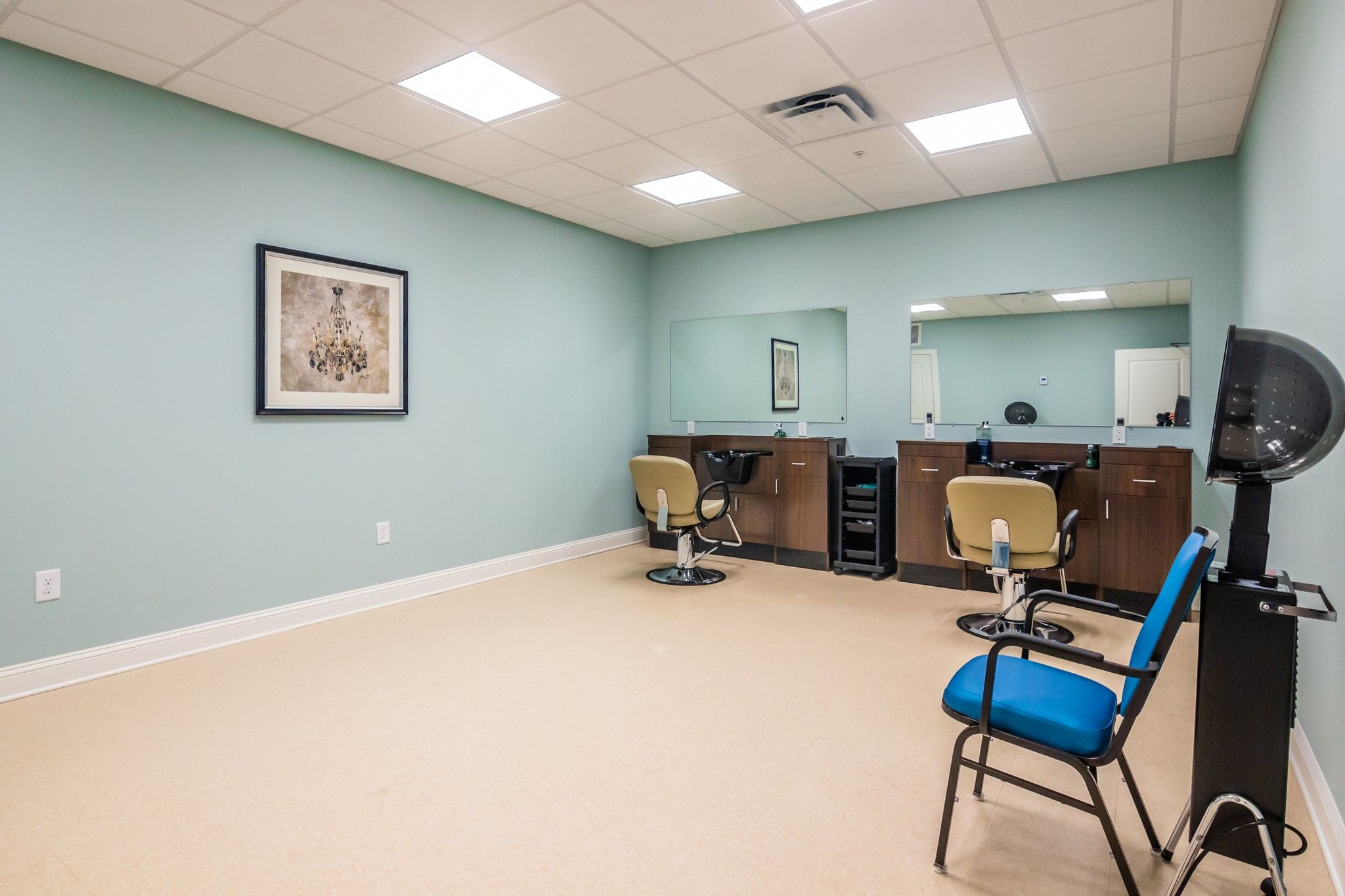 The Claiborne at Acworth resident salon amenity with styling chairs