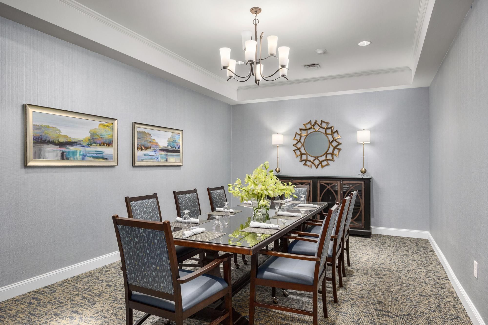 The Claiborne at Acworth amenity private dining room with dining table and chairs and upscale furnishings
