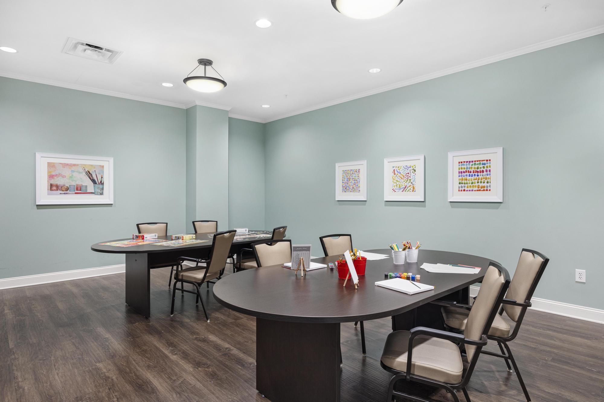 The Claiborne at Johns Creek senior living community art and painting activity in progress in the activity room