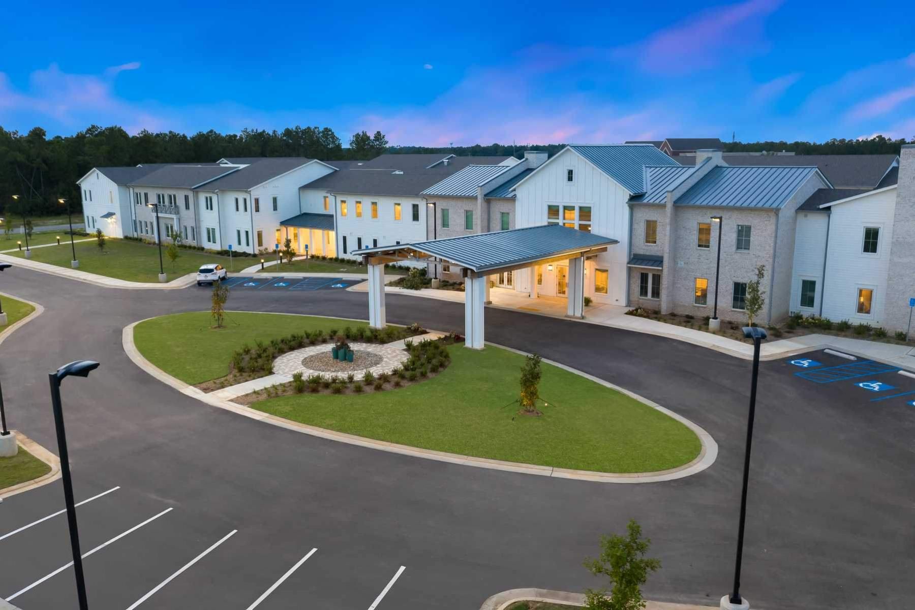 The Claiborne at Johns Creek aerial view of community and bus that provides transportation