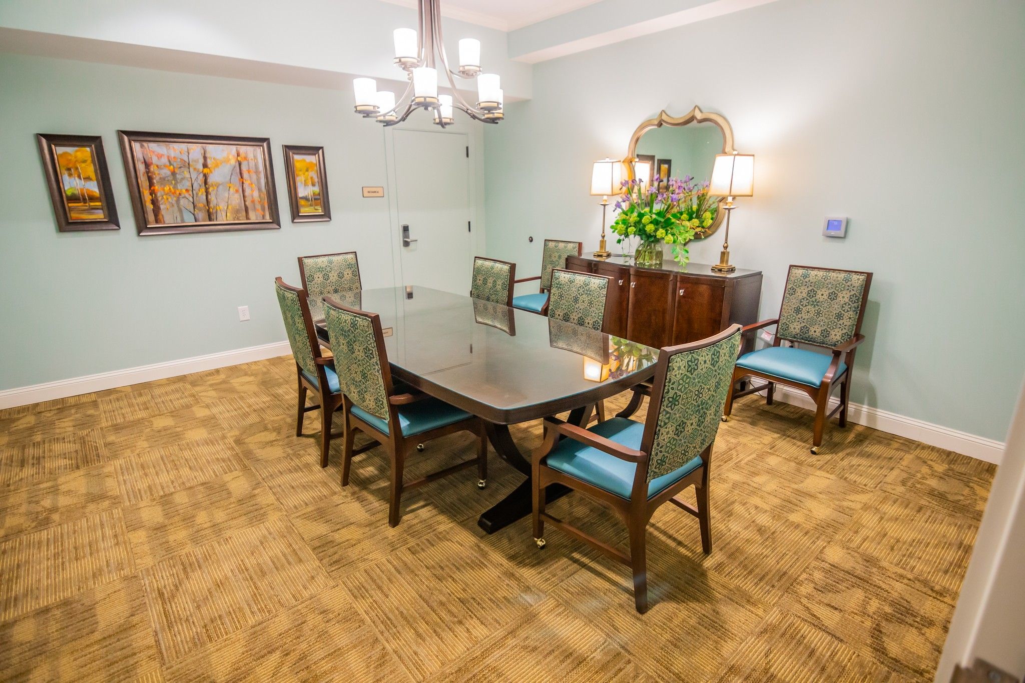 The Claiborne at Roswell amenity private dining room with dining table and chairs and upscale furnishings