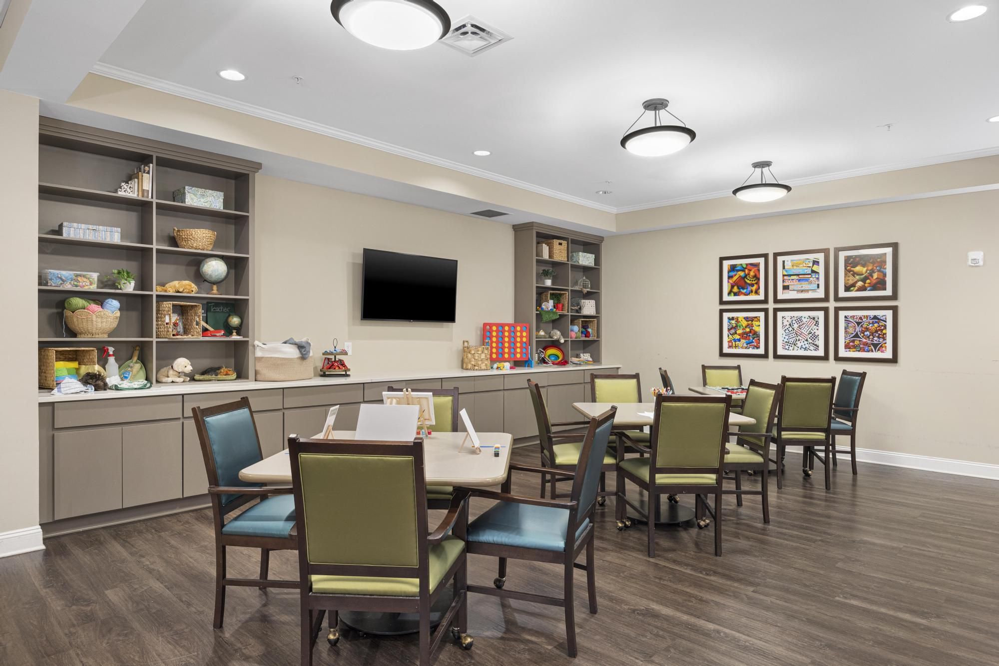 The Claiborne at Roswell senior living community art and painting activity in progress in the activity room