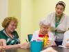 The Claiborne at Roswell senior living community creative activity in progress with an instructor