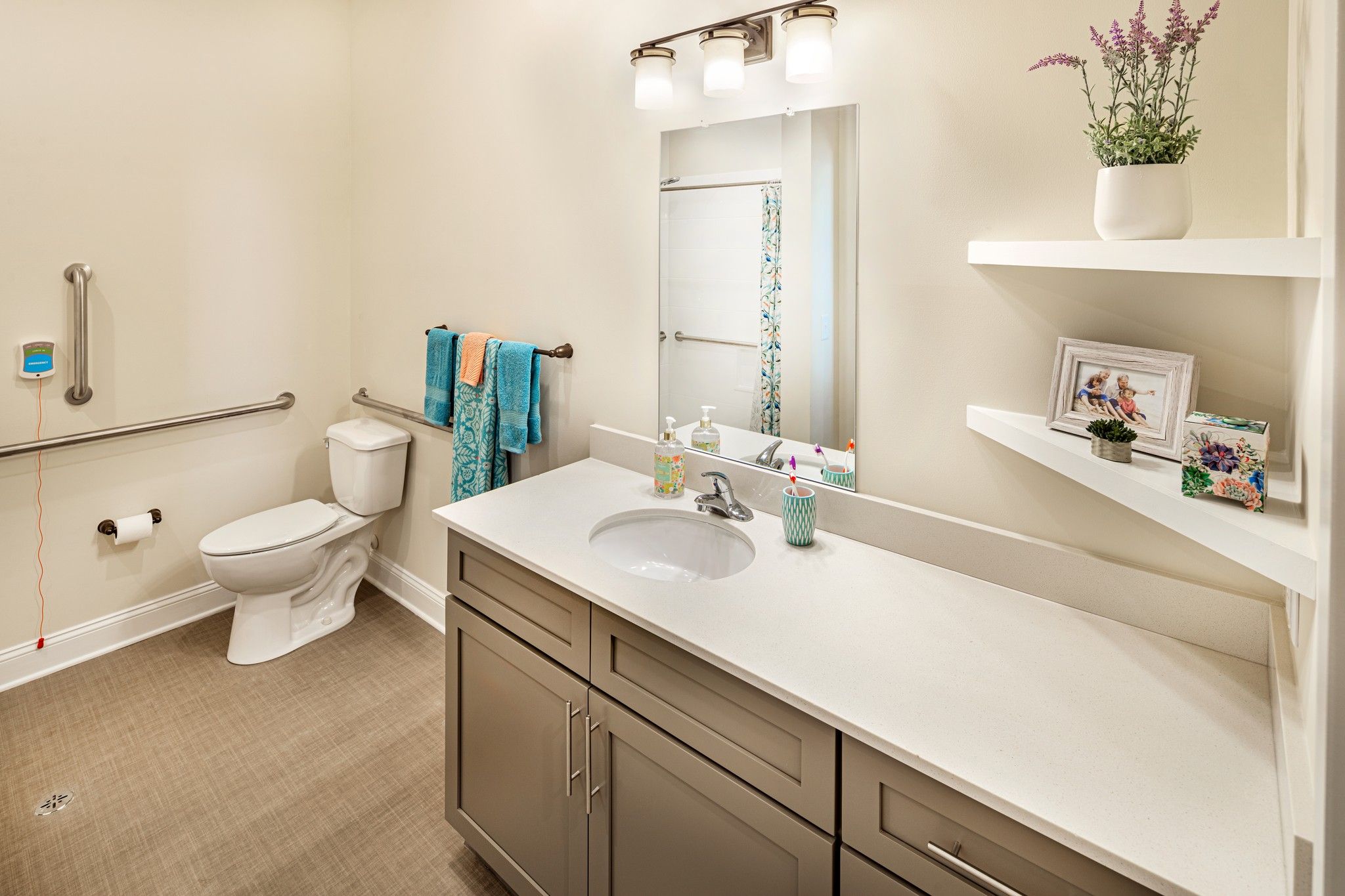 The Claiborne at West Cobb apartment bathroom with accessible toilet and ample storage
