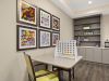The Claiborne at West Cobb resident gaming lounge amenity with tables, chairs, games, and wall art