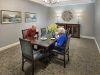 The Claiborne at West Cobb amenity private dining room with dining table and chairs and upscale furnishings
