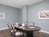 The Claiborne at West Cobb resident gaming lounge amenity with full kitchen, tables, chairs, games, and wall art