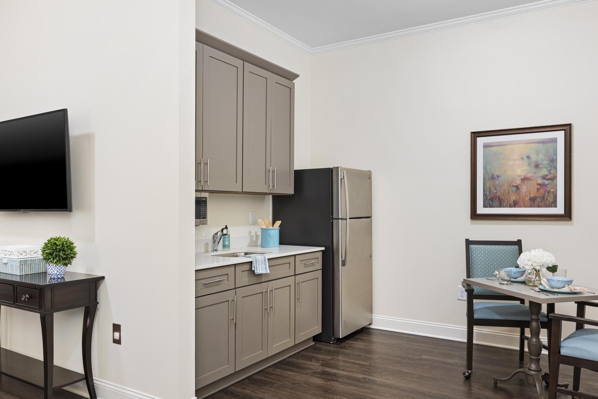 The Claiborne at Woodstock apartment bedroom with full sized bed, carpeting, and large windows