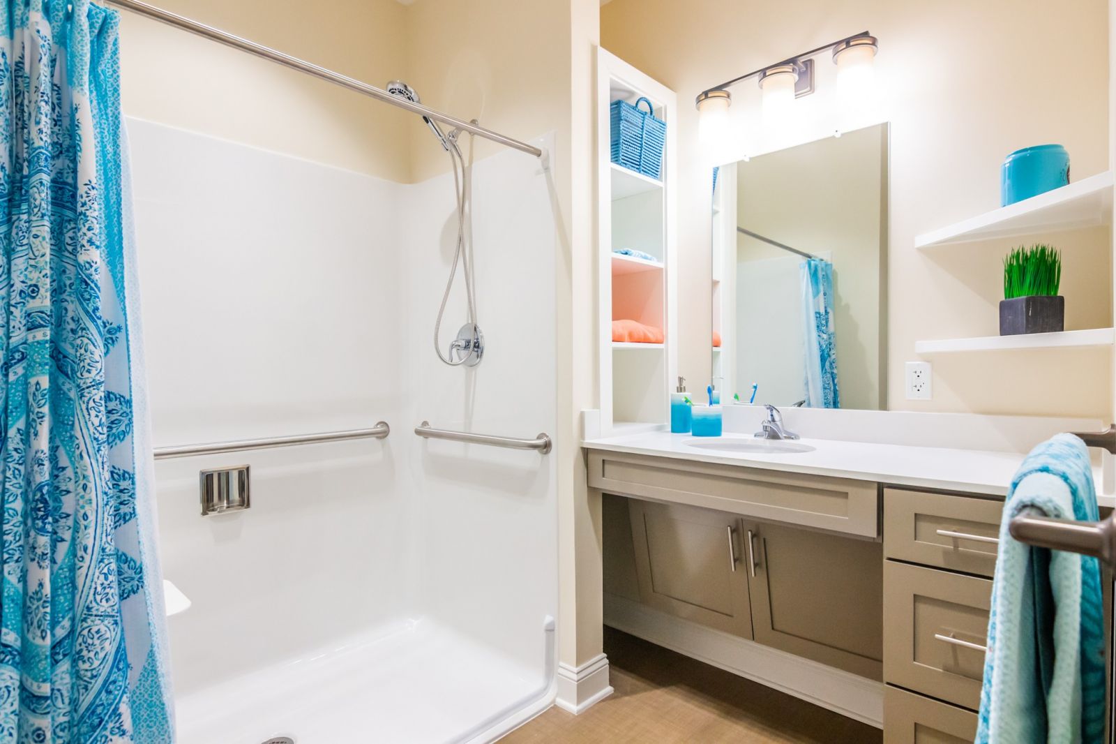 The Claiborne at Woodstock upscale apartment kitchenette with quartz countertops, stainless steel appliances, and dining area