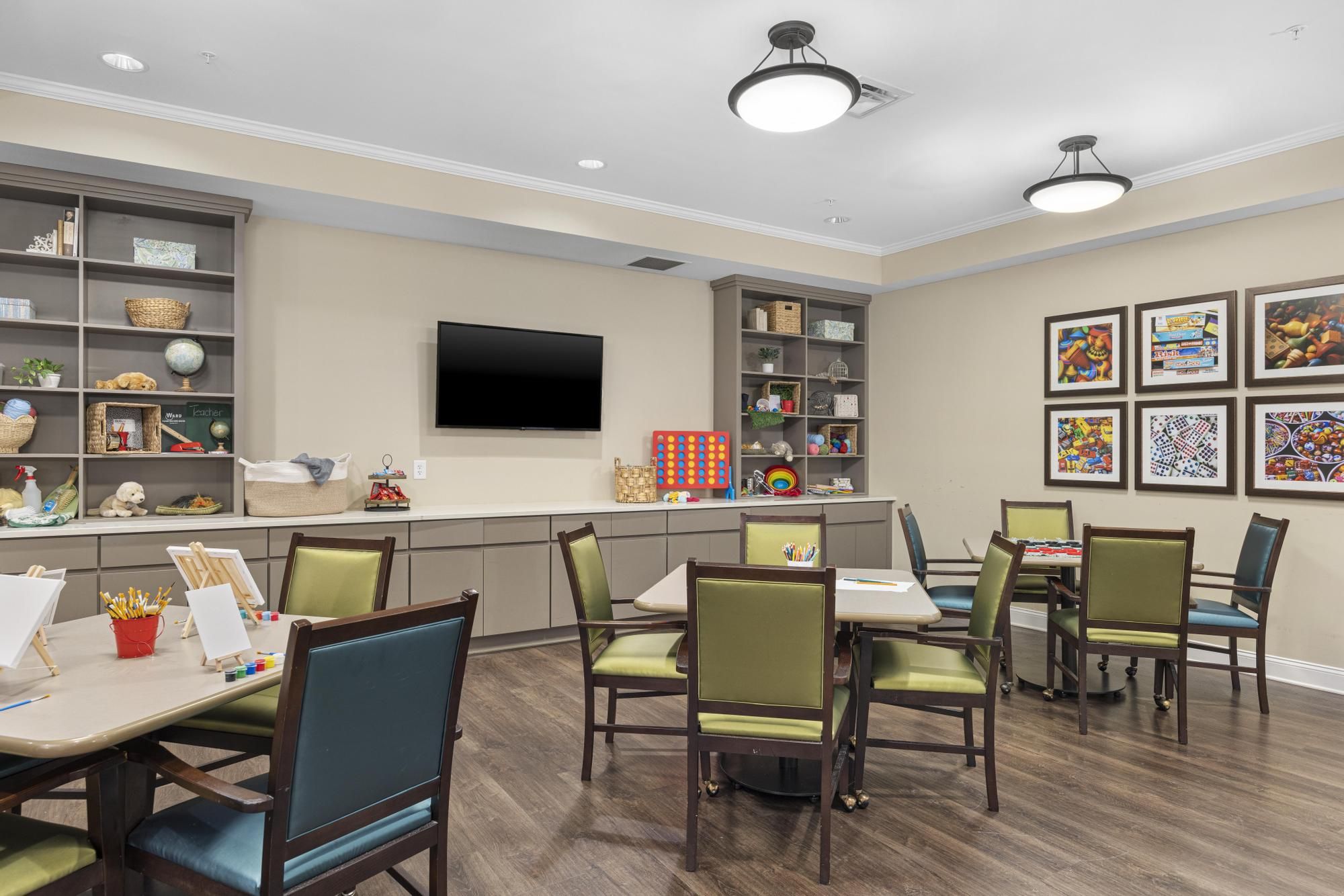 The Claiborne at Woodstock senior living community art and painting activity in progress in the activity room