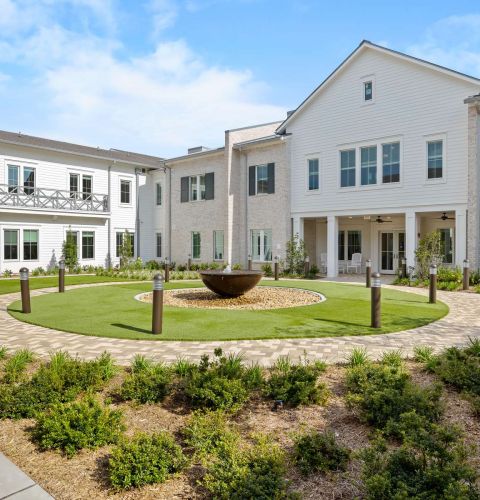 The Claiborne at Gulfport Highlands exterior view of senior community courtyard