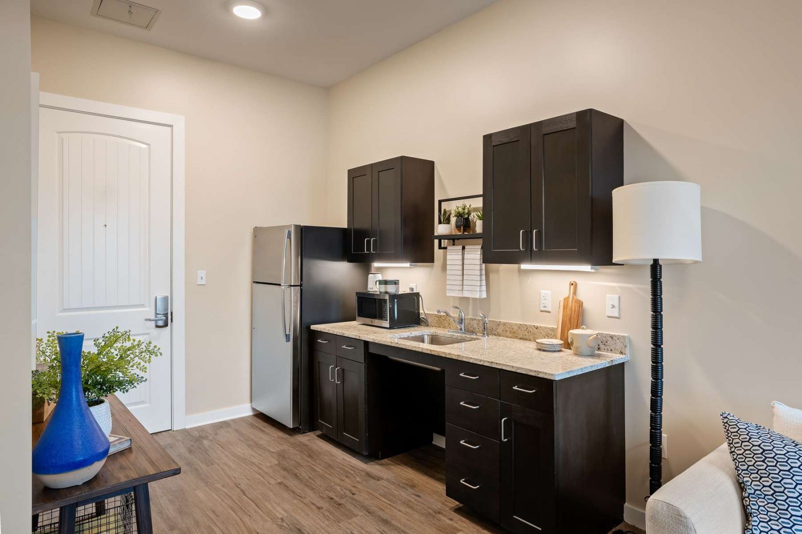 The Claiborne at Gulfport Highlands assisted living kitchenette showing accessibility features including sink and cabinet height