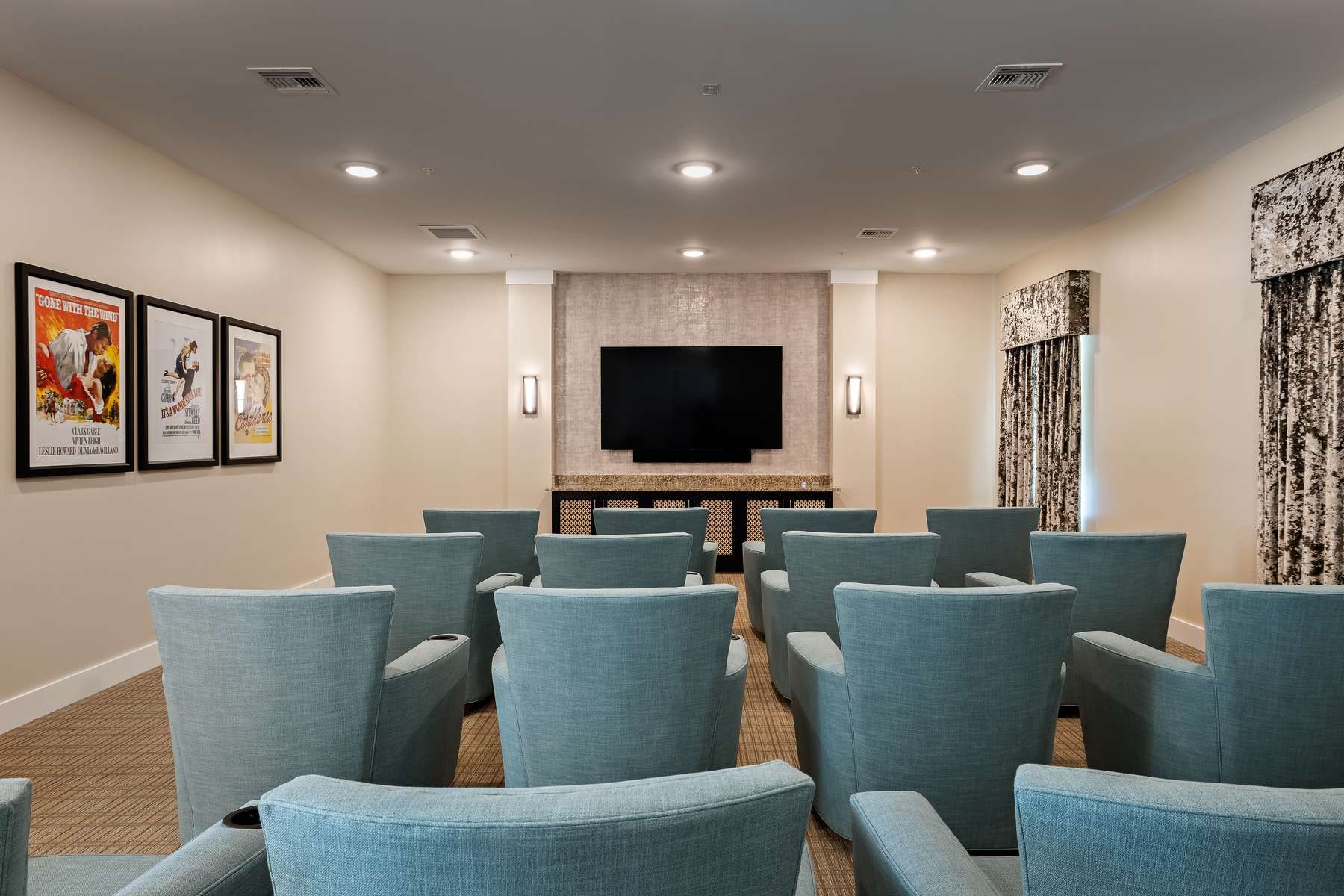 The Claiborne at Gulfport Highlands movie theater with comfortable seating and surround sound
