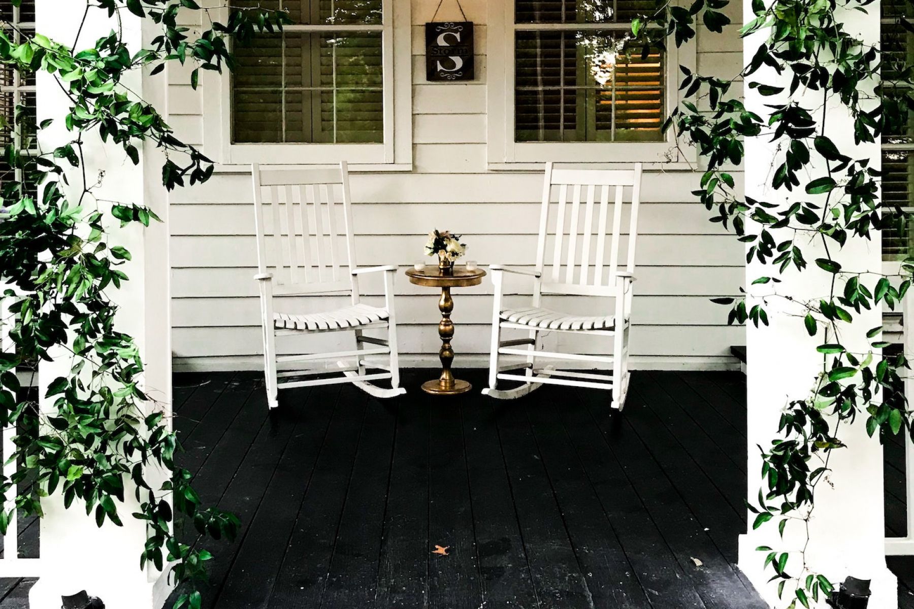The Claiborne at Gulfport Highlands rocking chairs on porch
