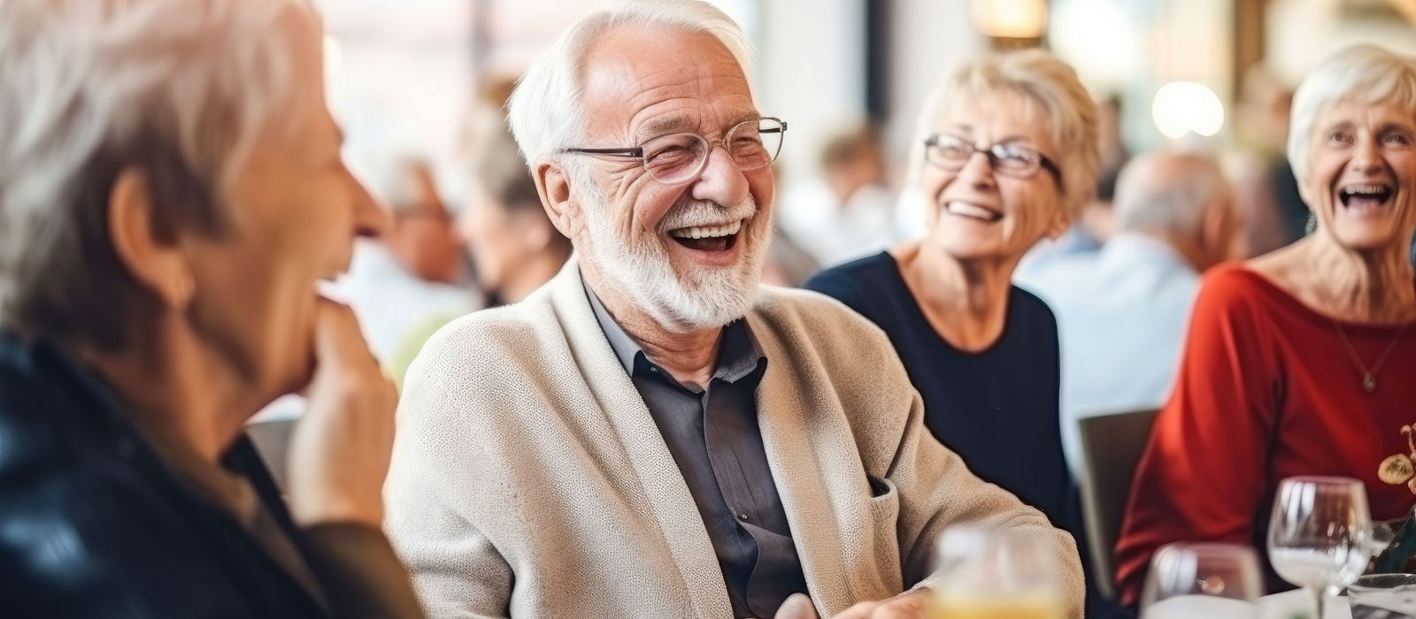 A candid photo of joyful senior citizens enjoying companionship at a social club, having fun and smiling.
