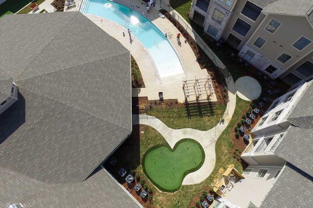 The Claiborne at Hattiesburg aerial view of pool and putting green