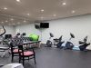 The Claiborne at Hattiesburg fitness center with free weights and cardio machines