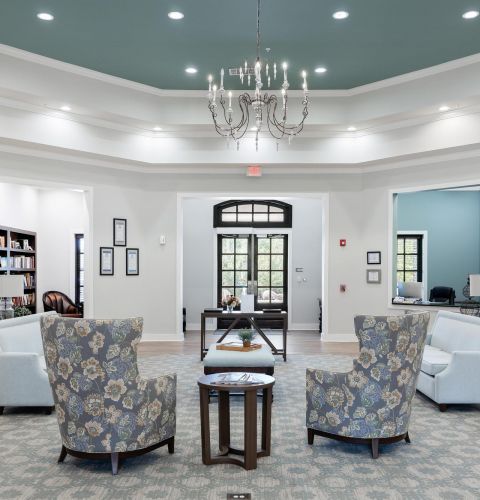 The Claiborne at Hattiesburg lobby with chandelier and seating
