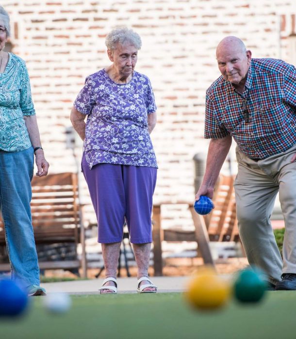 The Claiborne at Hattiesburg seniors playing Bocce ball