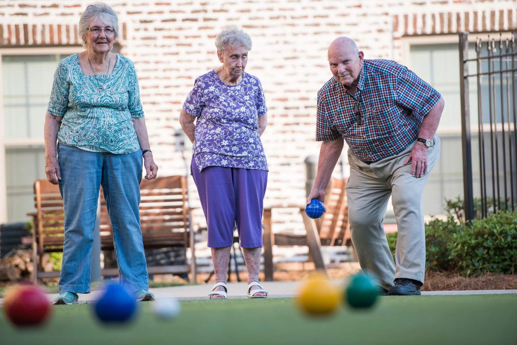 The Claiborne at Hattiesburg senior residents playing Bocce Ball