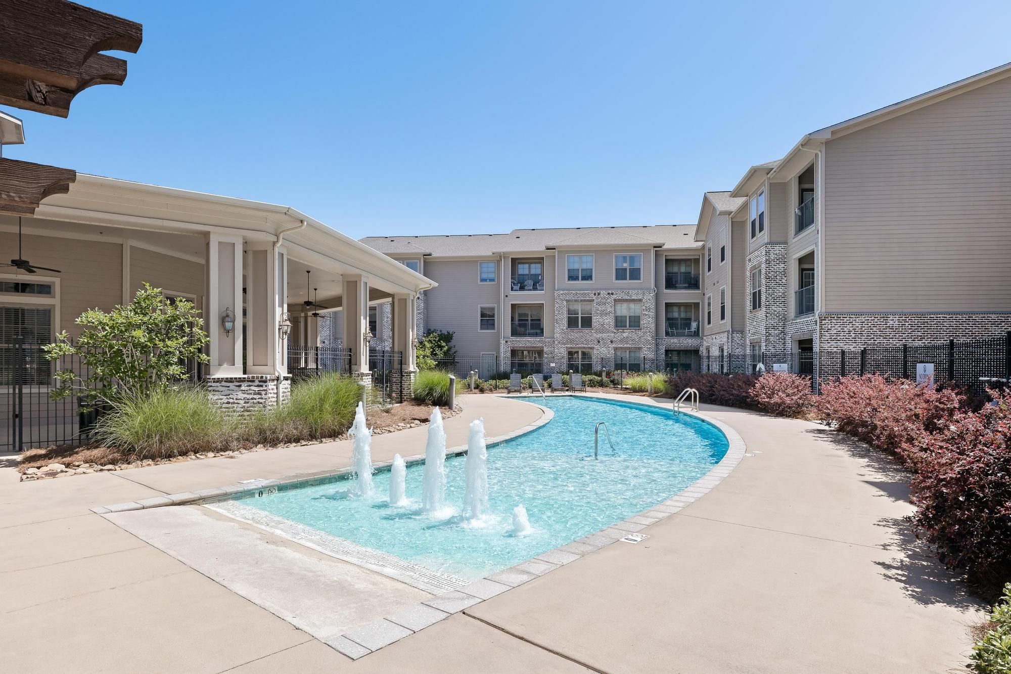 The Claiborne at Hattiesburg exterior view of  senior community with pool