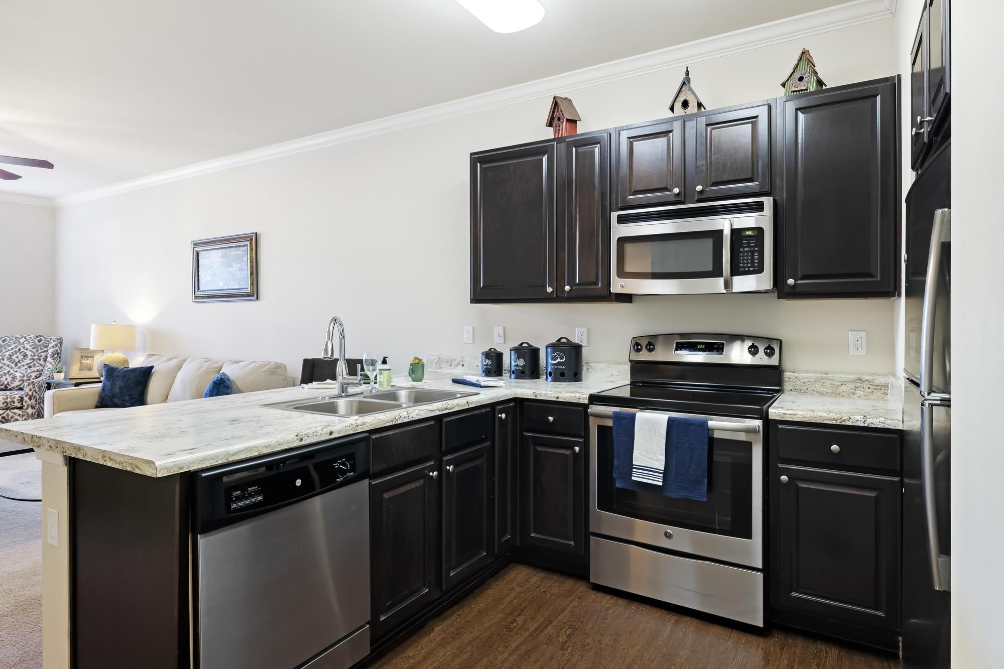 The Claiborne at Hattiesburg senior apartment full kitchen with high-end design and appliances