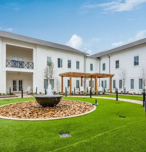 The Claiborne at McComb outdoor courtyard with fountain and terrrace