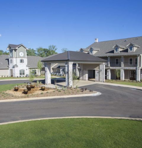 The Claiborne at McComb exterior view of senior community courtyard