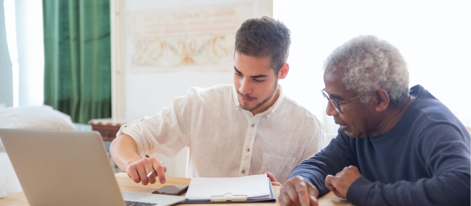 Man and finance specialist going over paperwork