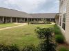 The Claiborne at McComb outdoor putting green at senior living community