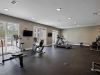 The Claiborne at Newnan Lakes gym with exercise equipment and on-site therapy services