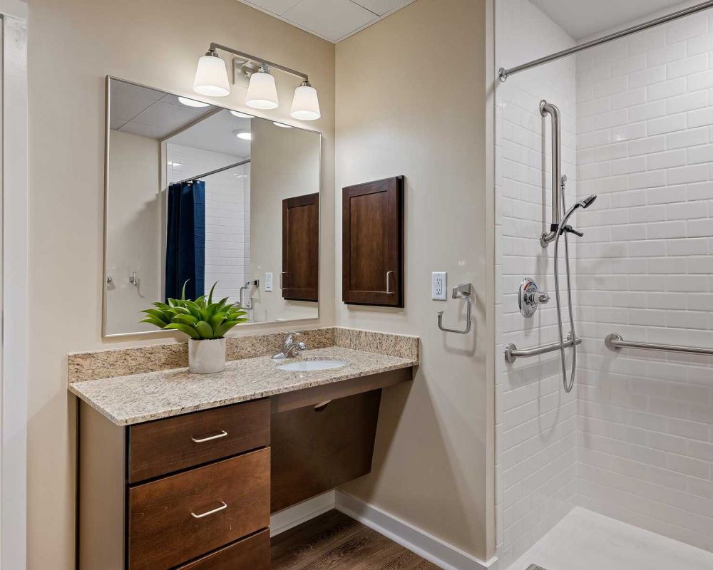 The Claiborne at Newnan Lakes memory care unit bathroom with accessibility features