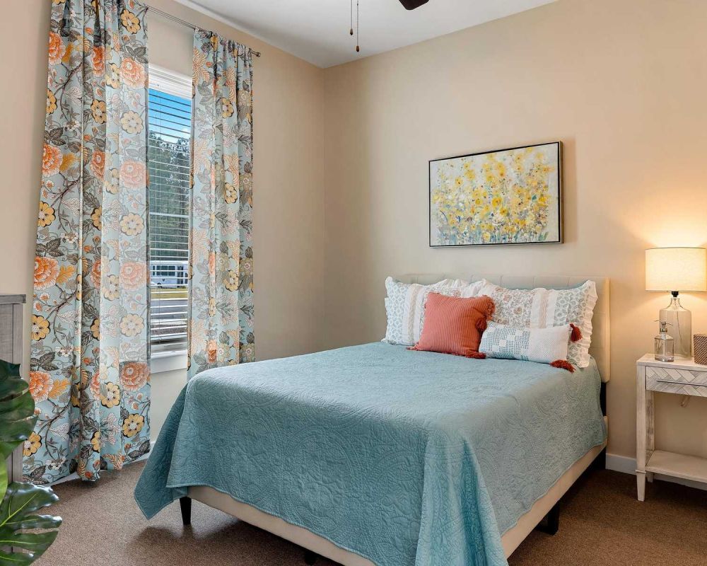 The Claiborne at Newnan Lakes senior living community assisted living bedroom