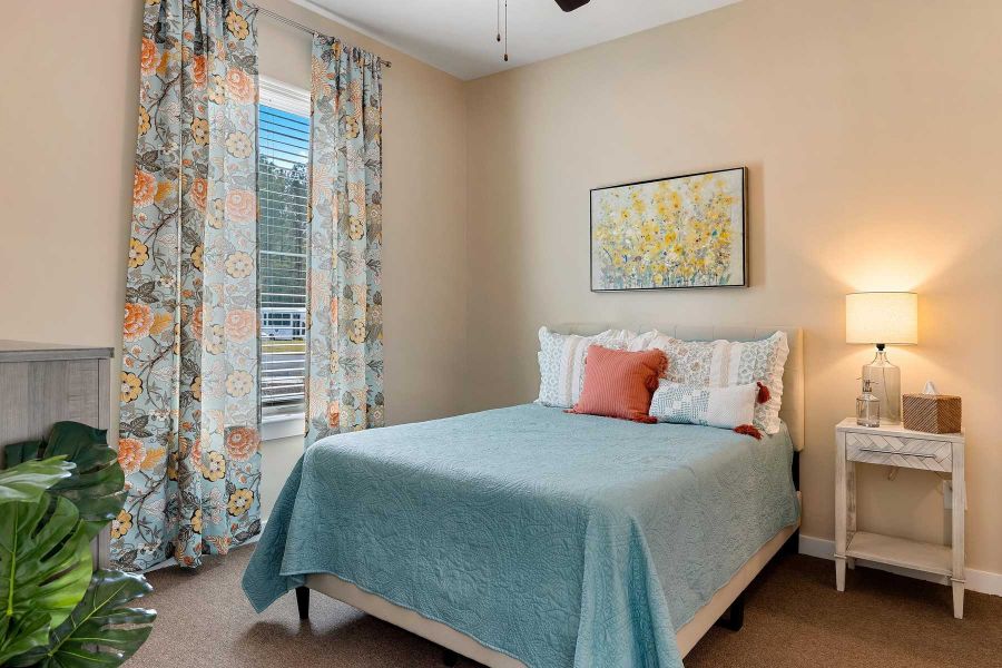 The Claiborne at Newnan Lakes senior living community assisted living bedroom